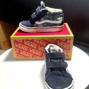 Vans shark high tops.